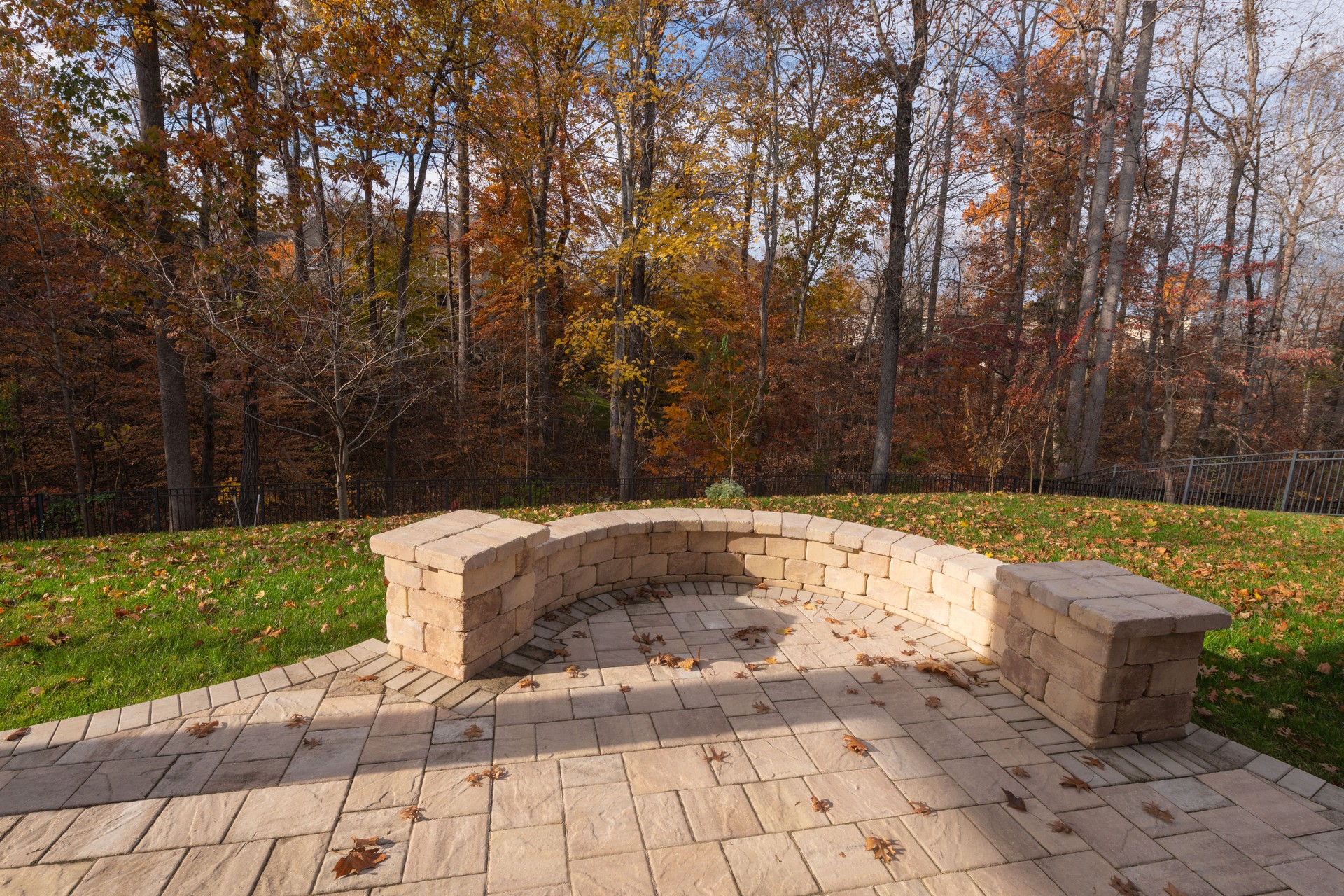 Scenic Backyard with Stone Wall in Autumn