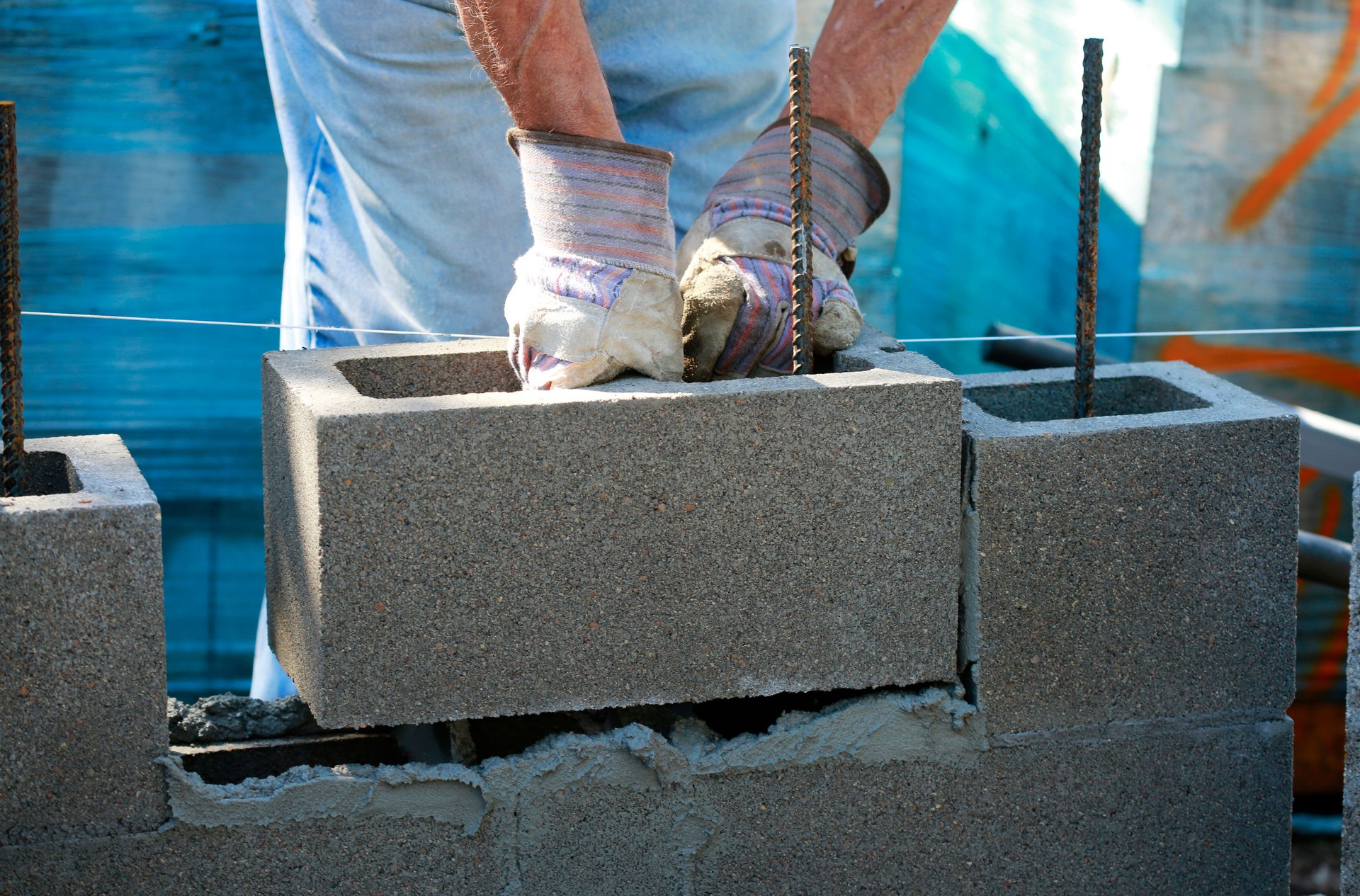 Mason in laying concrete blocks
